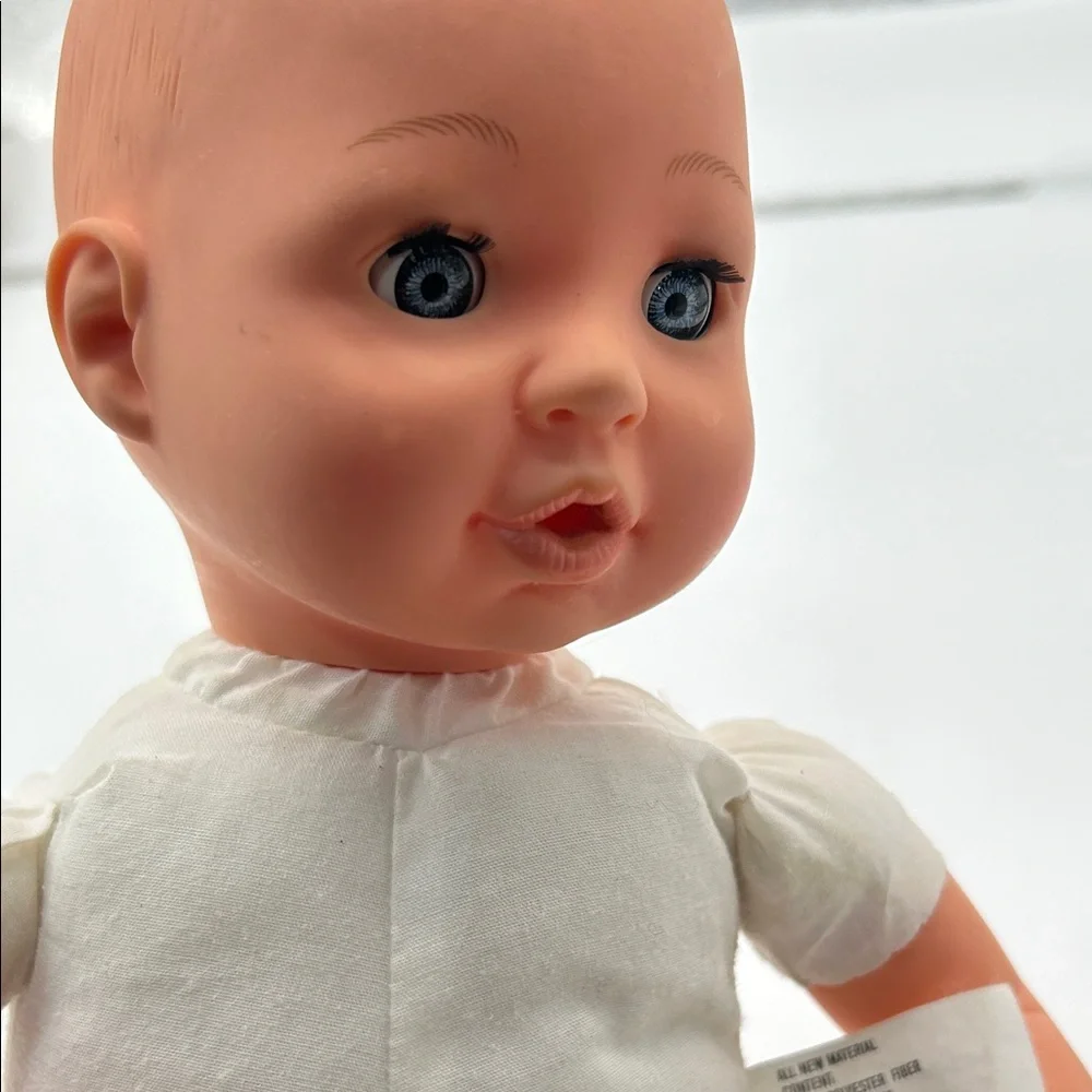 Realistic Baby Doll with White Outfit